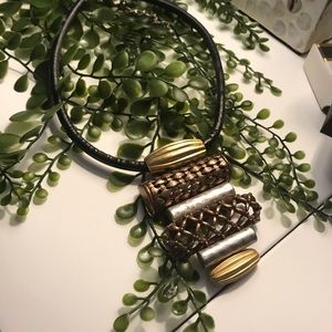 Vintage Brass, silver, and Copper medallion on a thick leather choker. Unusual.